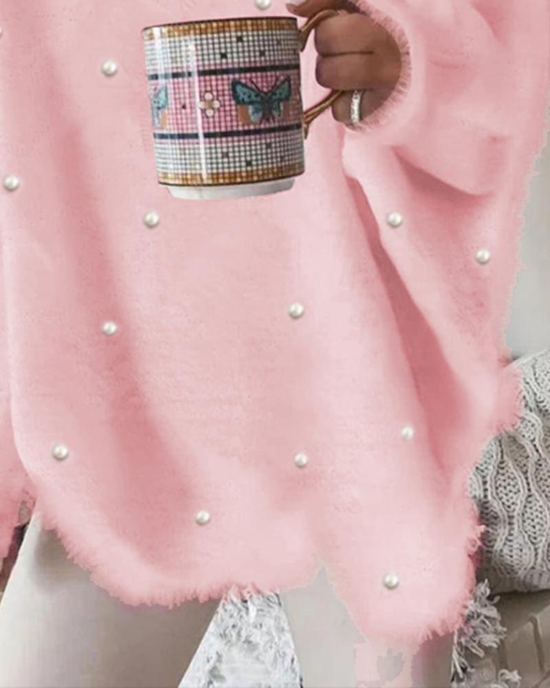 Volný svetr s výstřihem do V , dlouhým rukávem a korálky, zdobený ozdobou